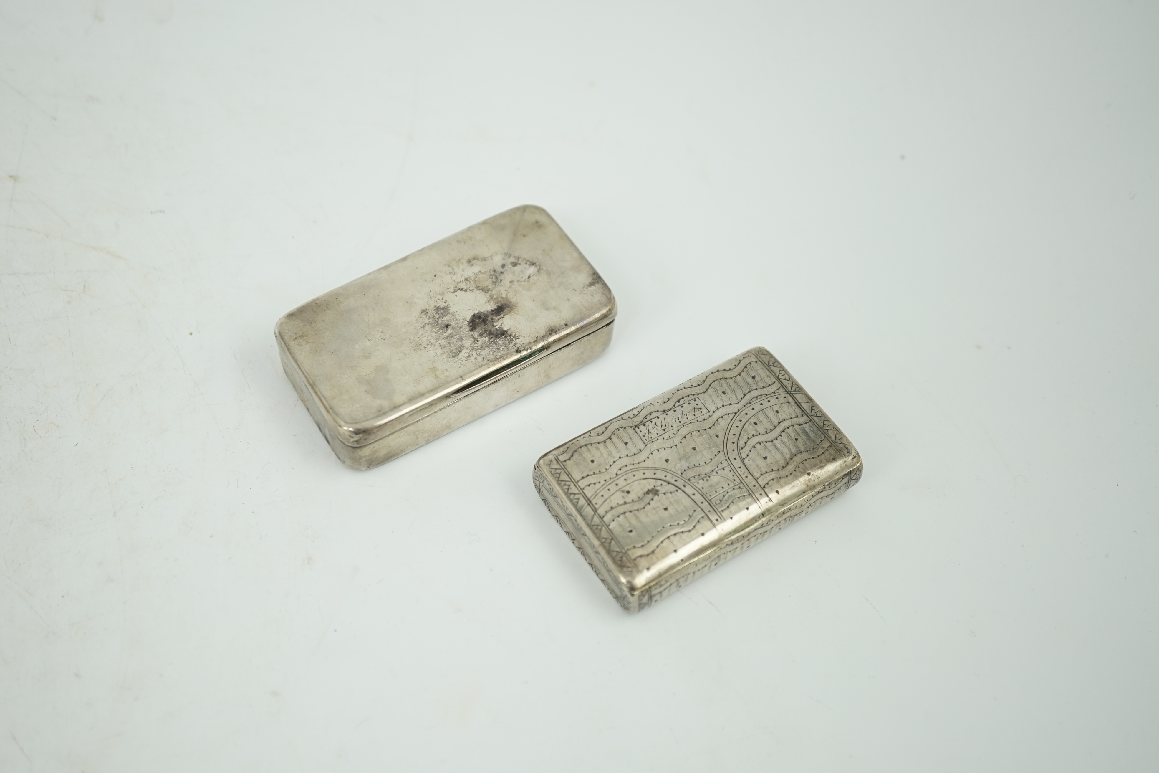 A George III silver snuff box, maker's mark rubbed, London, 1807, 74mm, together with an early 19th century Russian 84 zolotnik snuff box, dated 1819, 64mm.